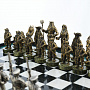 Шахматы "Пираты Карибского моря" с каменной доской и фигурами из бронзы 40х40 см, фотография 1. Интернет-магазин ЛАВКА ПОДАРКОВ