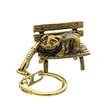 0056219 Сувенир БРЕЛОК "ПОРОСЕНОК НА СКАМЕЙКЕ" Бронза